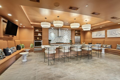 A modern dining room with a large table and chairs.
