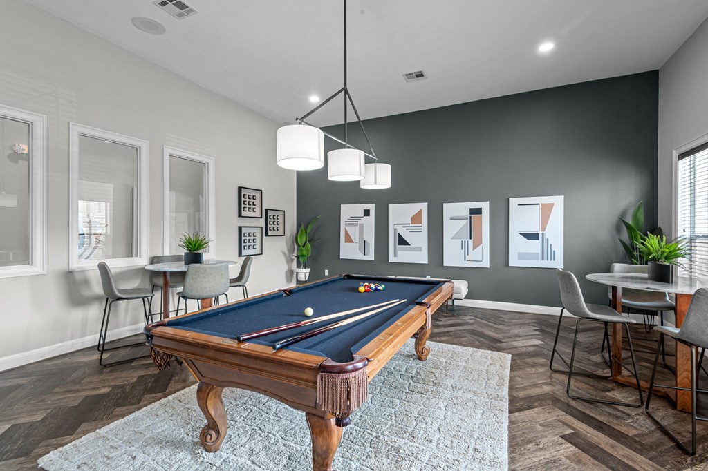 play a game of pool in your clubhouse at villas