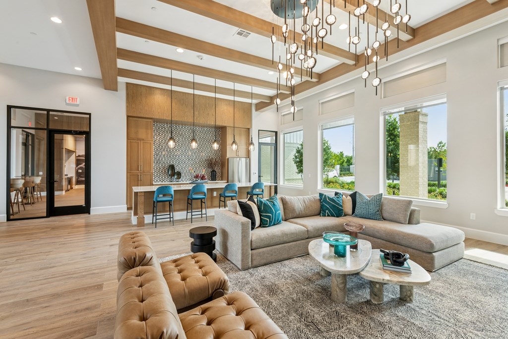 A modern living room with a large sectional sofa and a coffee table.