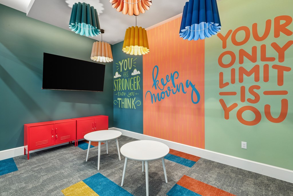 A room with a quote on the wall that says