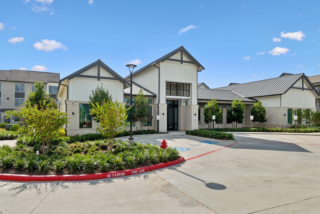 A building with a red fire hydrant in front of it.