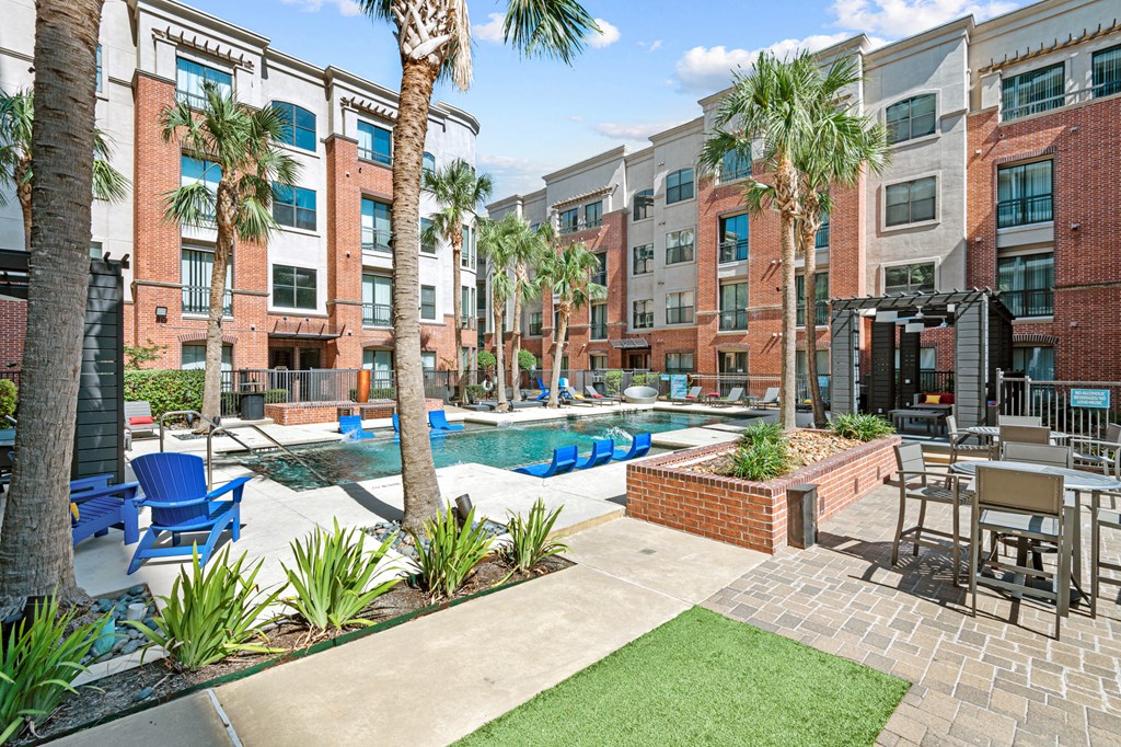 our apartments offer a pool and lounge area with palm trees