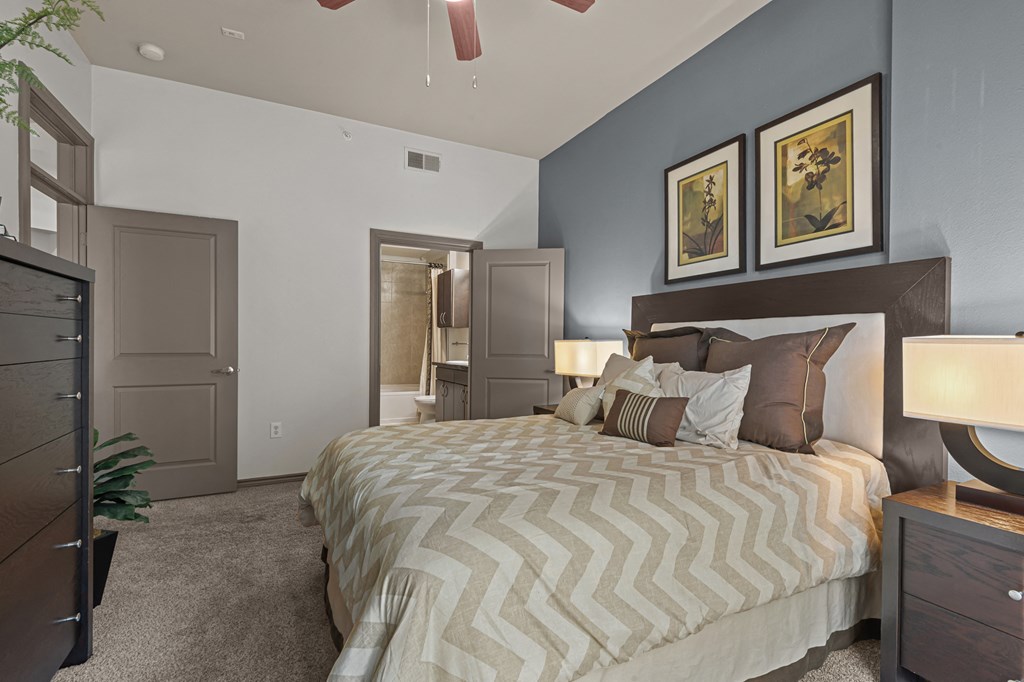 a bedroom with a large bed and a closet