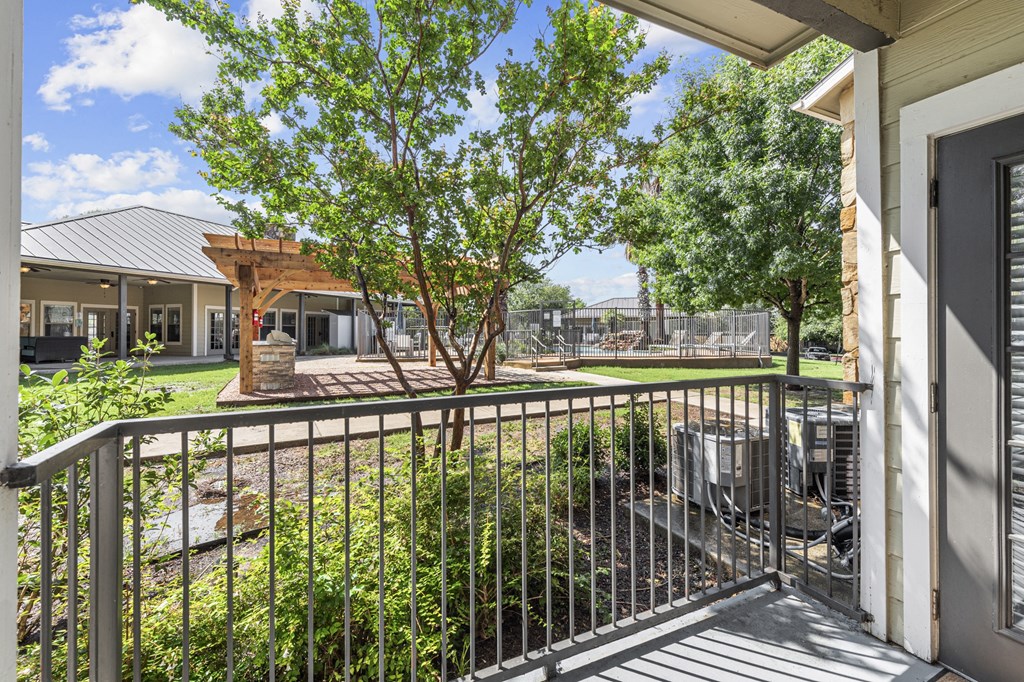 the preserve at ballantyne commons balcony and yard with trees