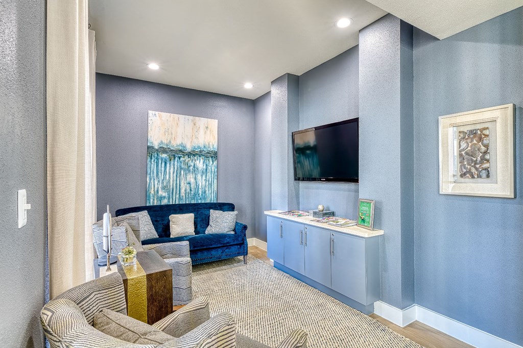 a living room with a couch and a tv