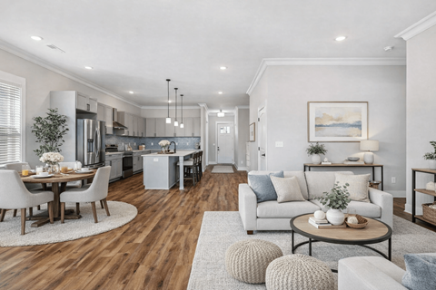 A modern living room with a dining table and chairs.