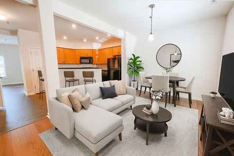 A living room with a grey couch and a coffee table.