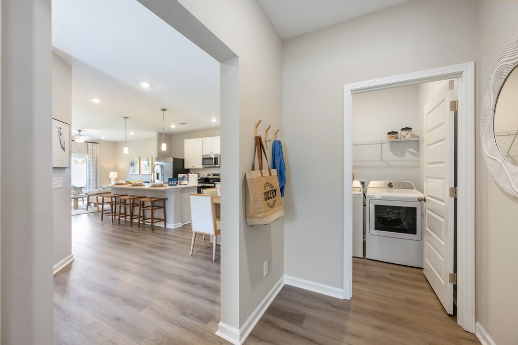 A kitchen with a white oven and a white refrigerator.