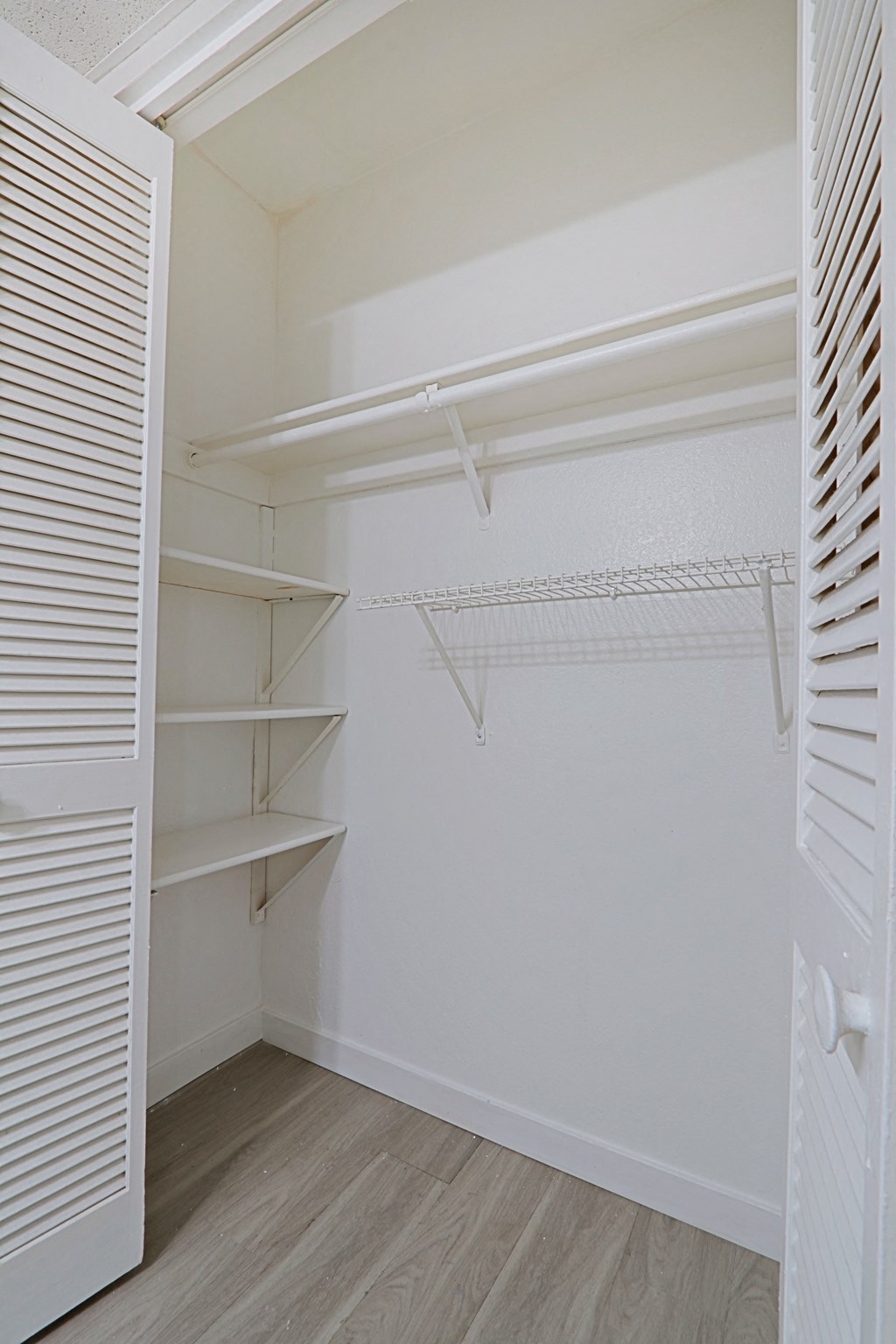 a walk in closet in a 555 waverly unit