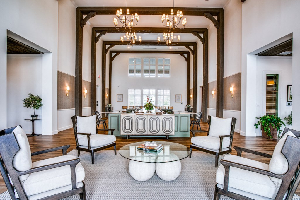 a living room filled with furniture and a large window