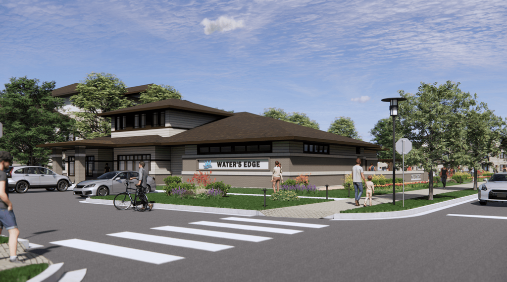 A street view of a building with the name "Water's Edge" on it.