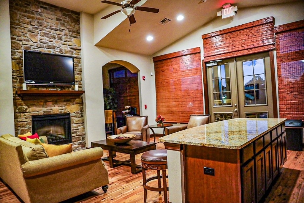 a living room with a bar and a fireplace