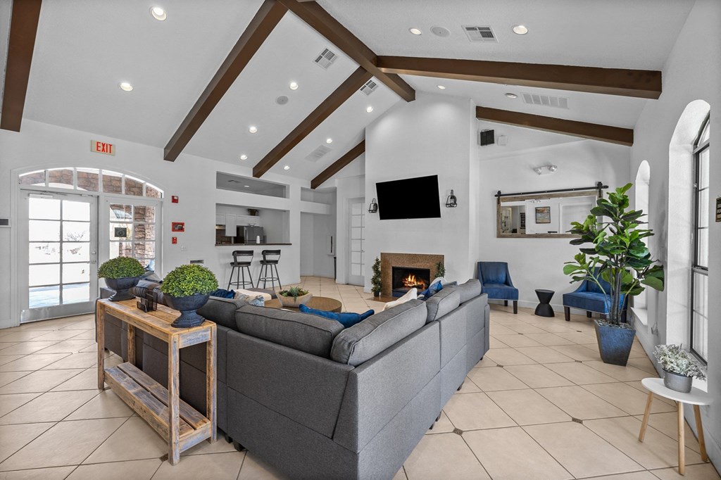 the living room of a house with a large couch and a fireplace