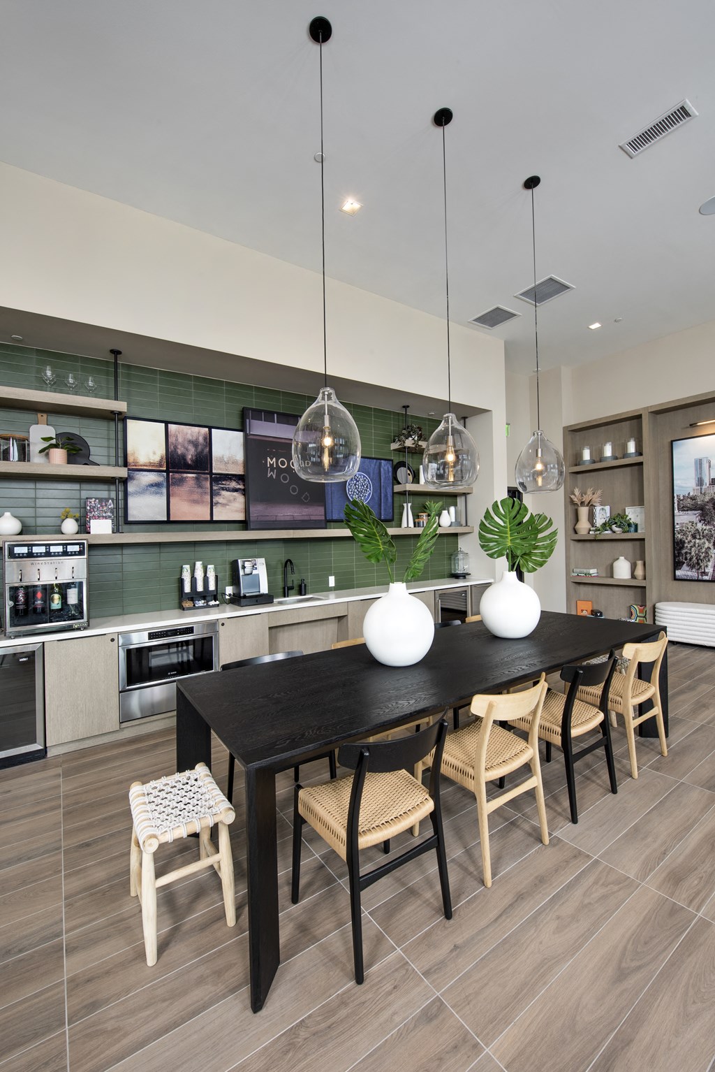 a kitchen and dining room with a table and chairs