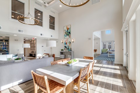 A dining room with a table and chairs is shown.