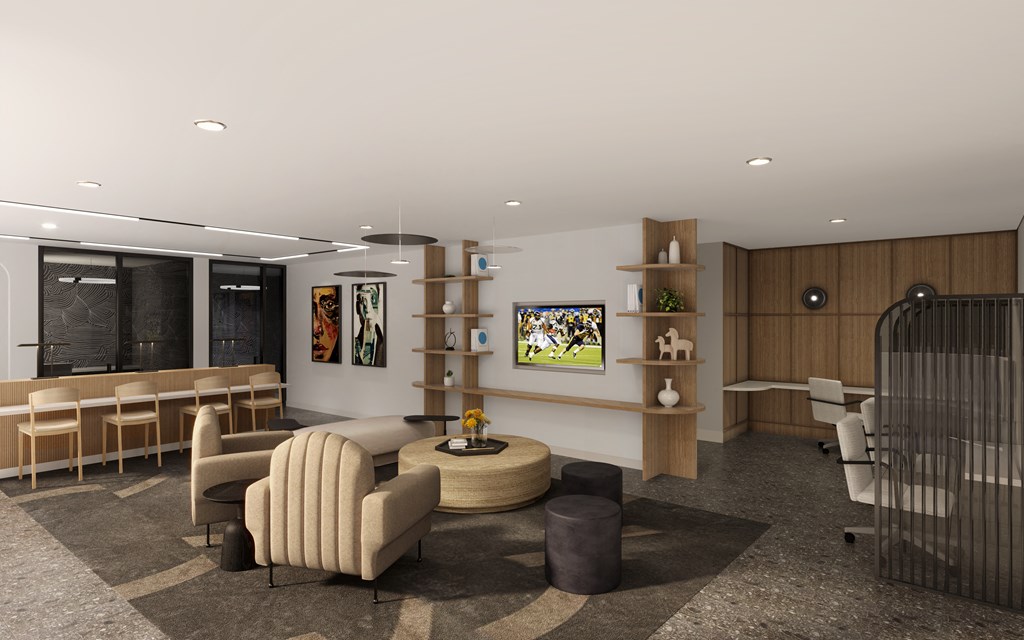 A modern living room with a large sofa, a coffee table, and a TV on the wall.