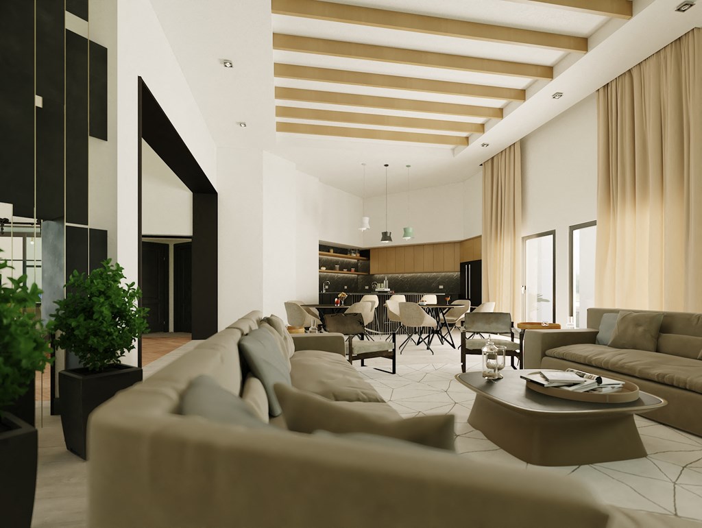 a living room with couches and chairs and a table