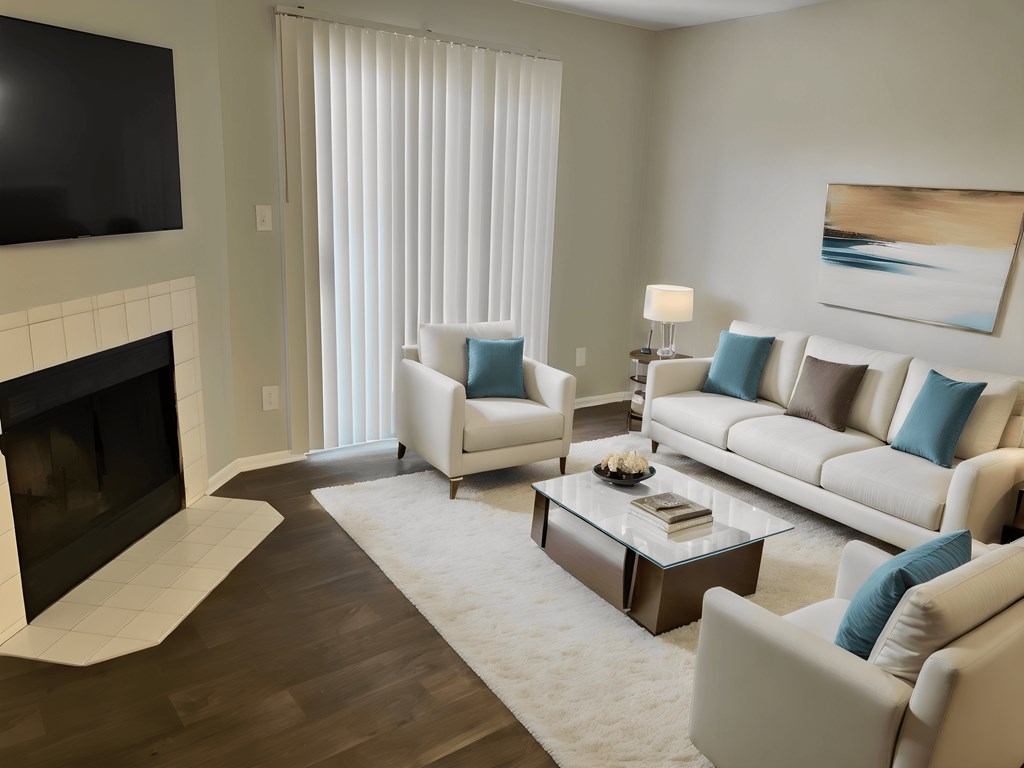a living room with white furniture and a fireplace