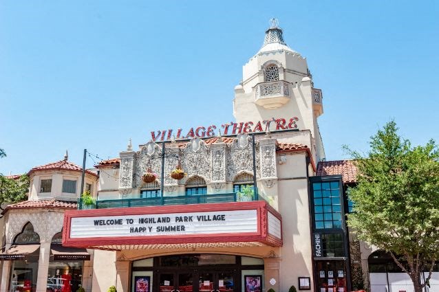 a theater with a sign on the front of it