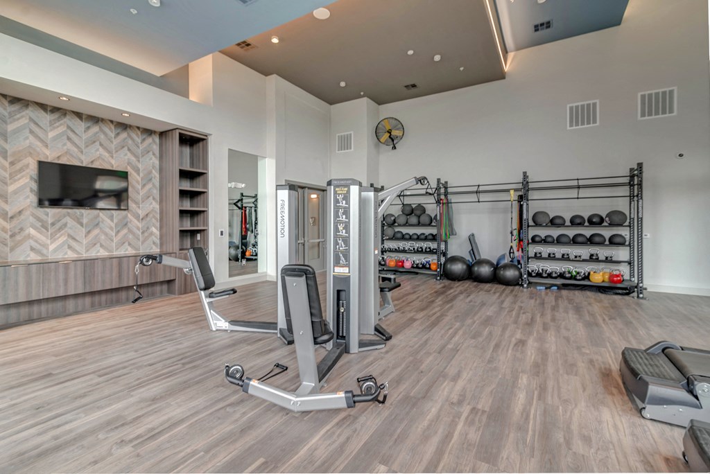 the estates with weights and a tv