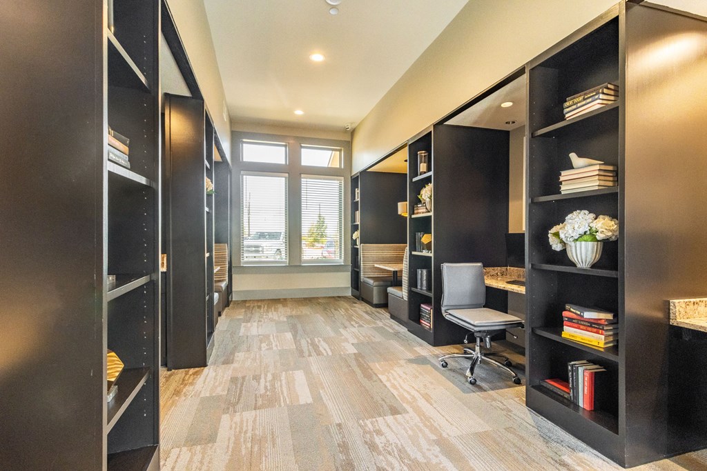 a large bookshelf in a room with a window