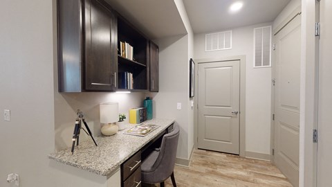 the preserve at ballantyne commons apartment kitchen with counter top and dark cabinets