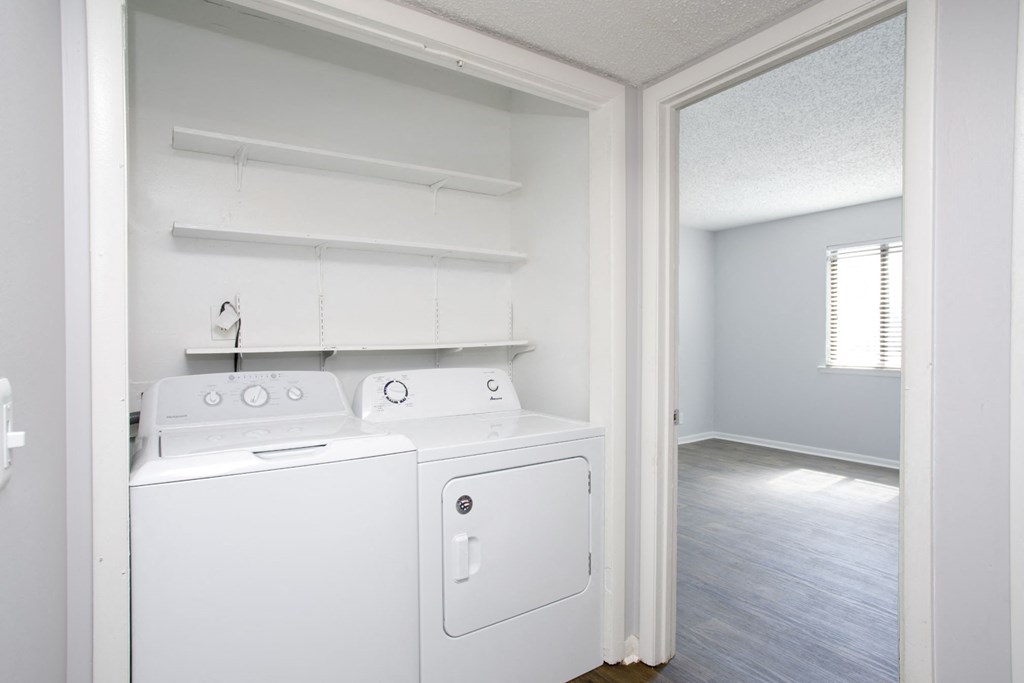 a laundry room with a washer and dryer