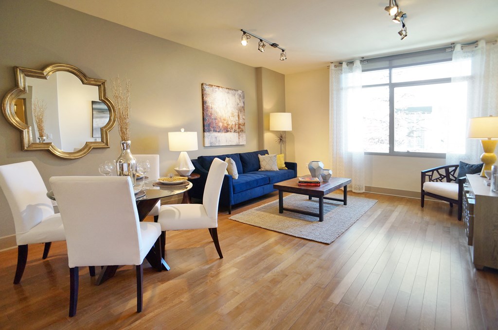 a living room and dining room with a couch and a table