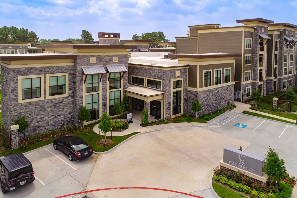 a large building with a parking lot in front of it