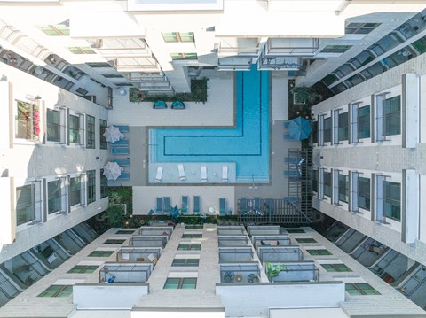 A view of a building's interior with a blue wall in the center.