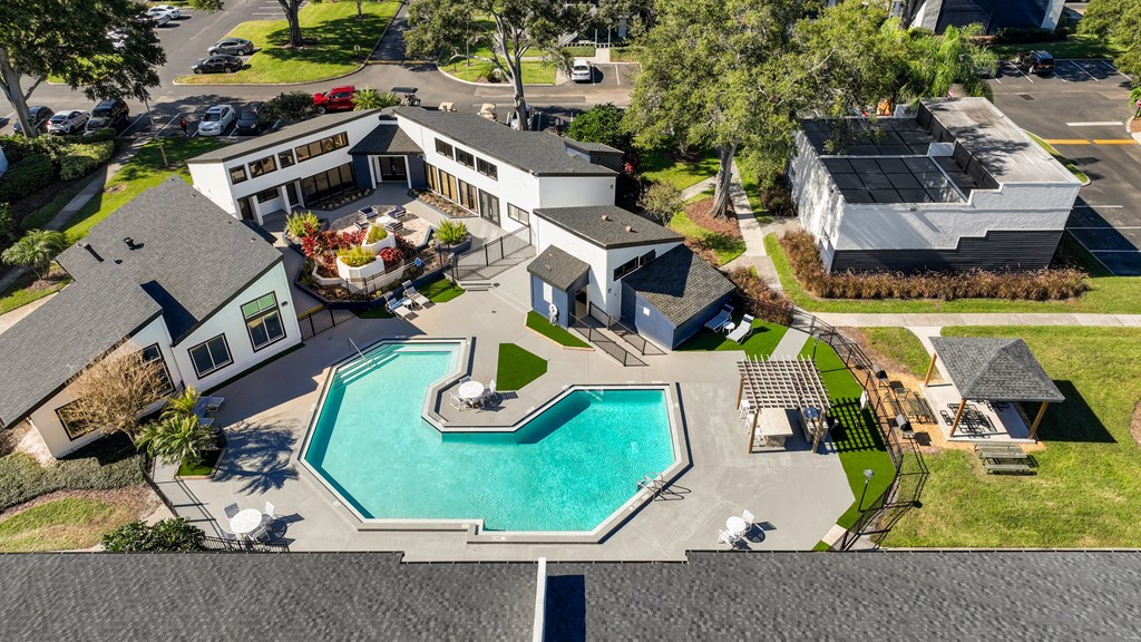 a house with a swimming pool in front of it