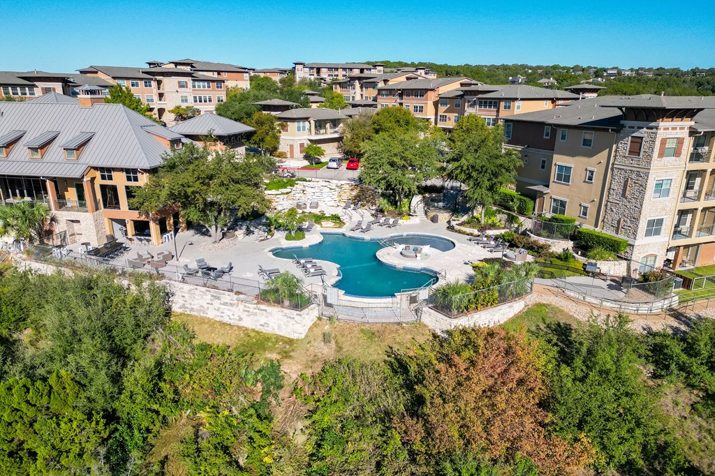 an aerial view of the resort with a swimming pool