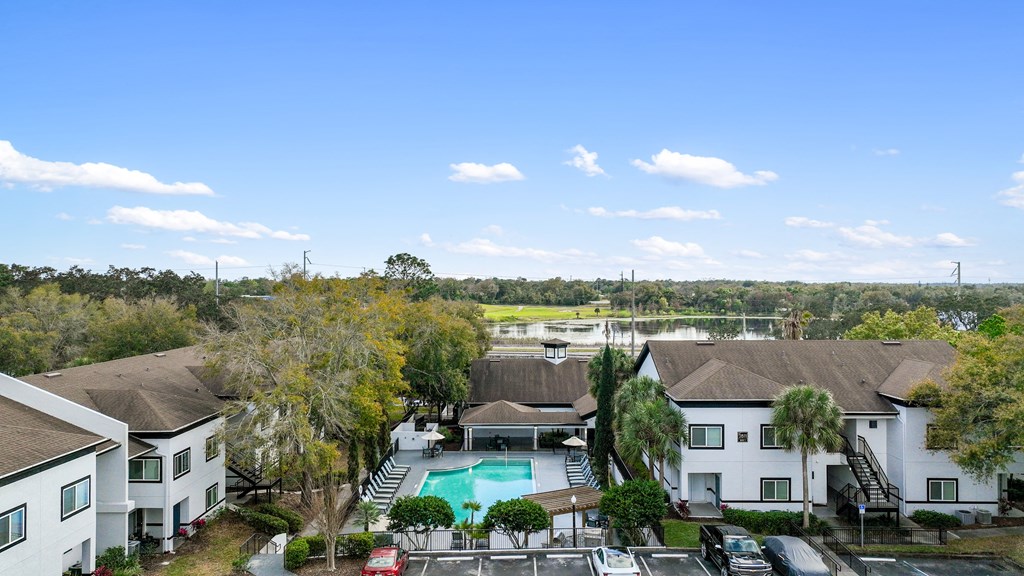 an aerial view of a neighborhood with a swimming pool and houses