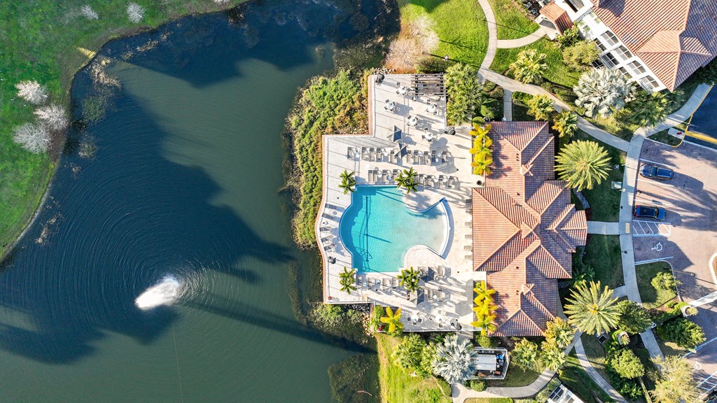 arial view of a pool and a body of water