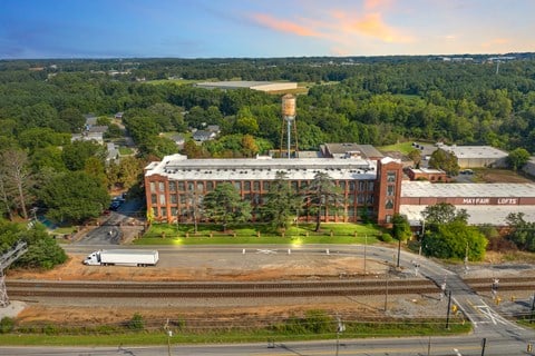 an aerial view of a building with a water tower