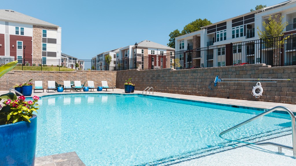 our apartments have a large swimming pool with lounge chairs