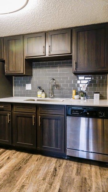 upgraded kitchen with stainless steel appliances in 78704 austin tx apartments - Photo Gallery 6