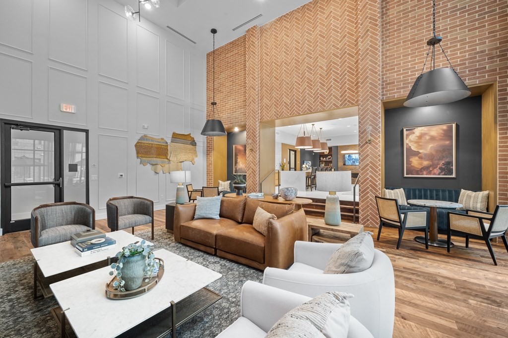A living room with a white sofa and a coffee table.