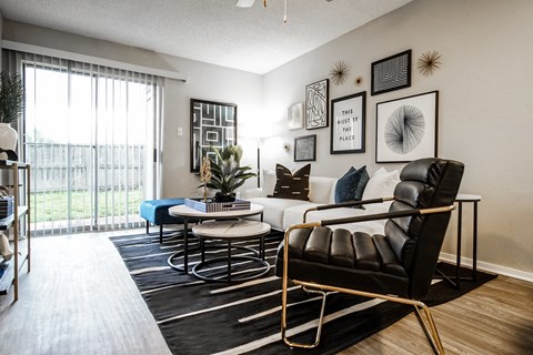 a living room with a white couch and a large window
