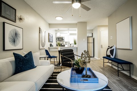 a living room with a white couch and a table