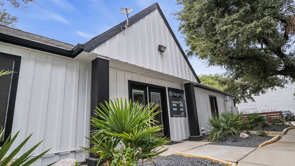 building with plants in the front
