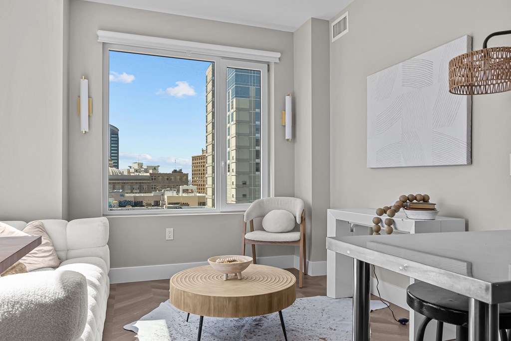 A modern living room with a view of the city.