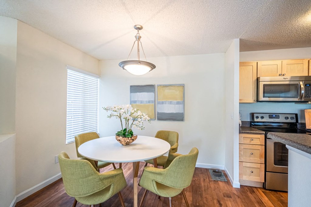 Model apartment home dining room area with table and chairs