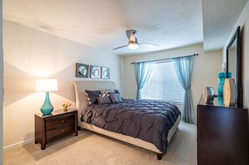 Vaulted ceilings in model apartment home bedroom