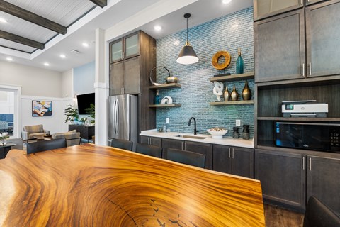 A modern kitchen with a wooden counter top.