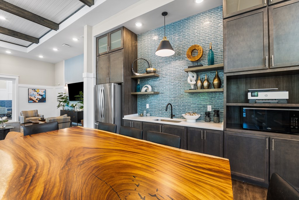 A modern kitchen with a wooden counter top.