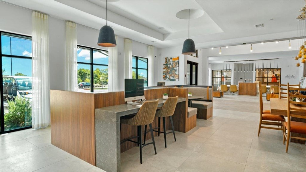 the kitchen and dining area of a modern house