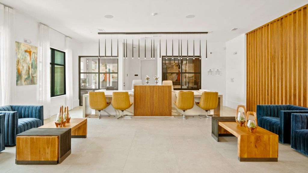 a living room with a bar and blue and yellow furniture
