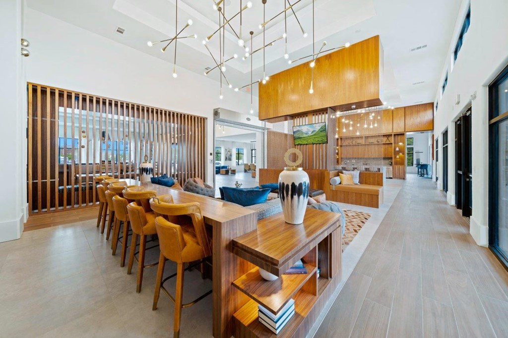 a dining room and living room with wooden tables and chairs