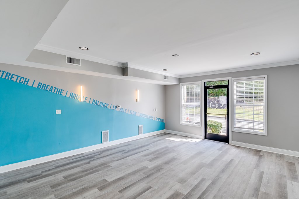 A room with a blue wall and a quote on it.